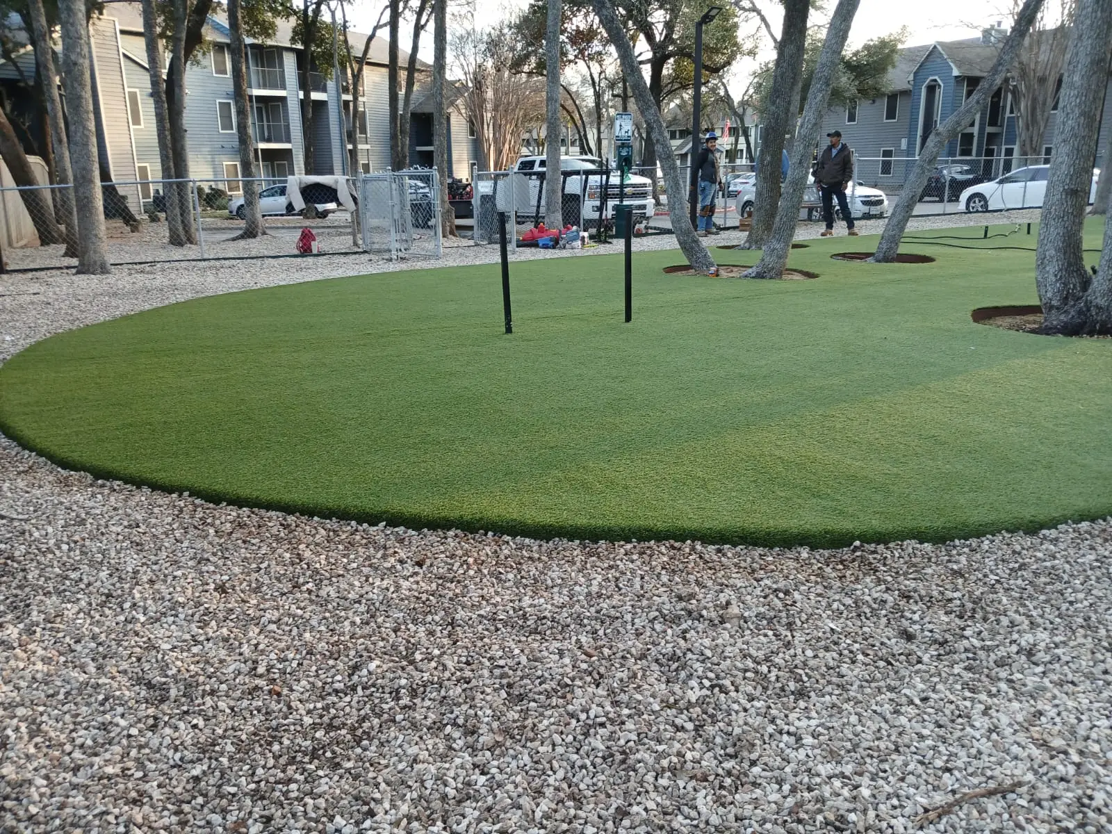 Shared turf recreation space and landscaped edges at SoNA Apartments.